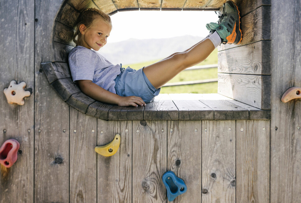 A girl is having fun at a playground in Kitzbühel