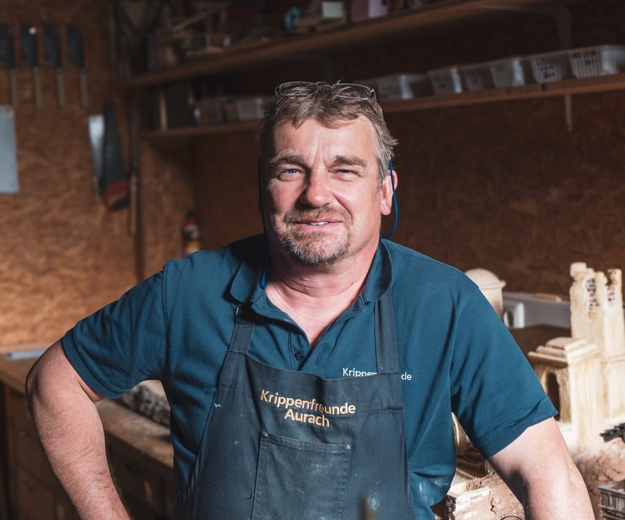 A man standing in his crafting room