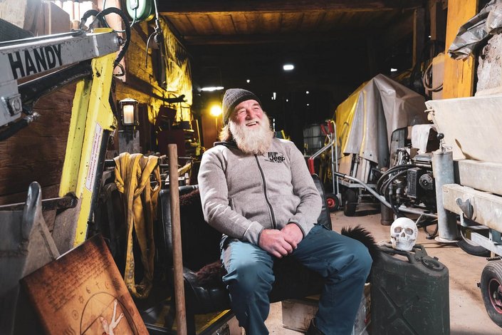 Sigi sitting in a garage