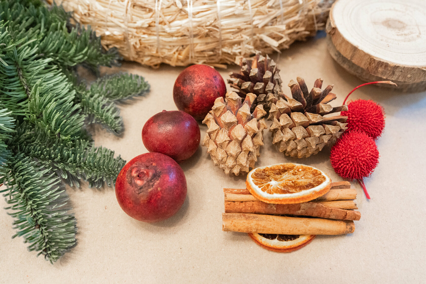 Dried orange slices, cinnamon sticks, dried flowers and pine cones make excellent decorations for an Advent wreath.