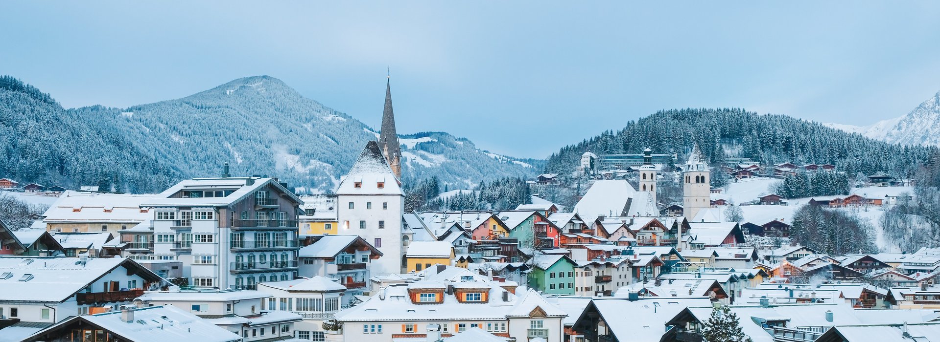 View of the snowy houses and roofs of Kitzbühel  