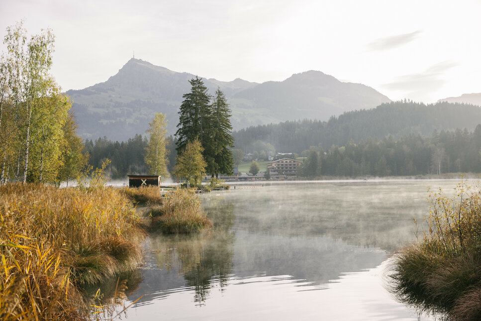 A view of Schwarzsee in autumn, with the Kitzbüheler Horn in the background