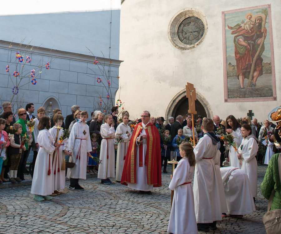 People gathering in front of the Church for Easter blessings