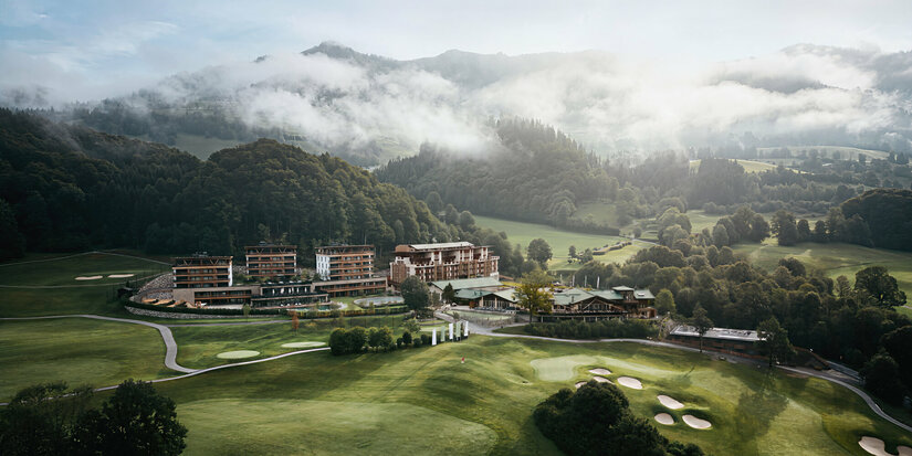 Exterior view of the Grand Tirolia, set amidst lush greenery