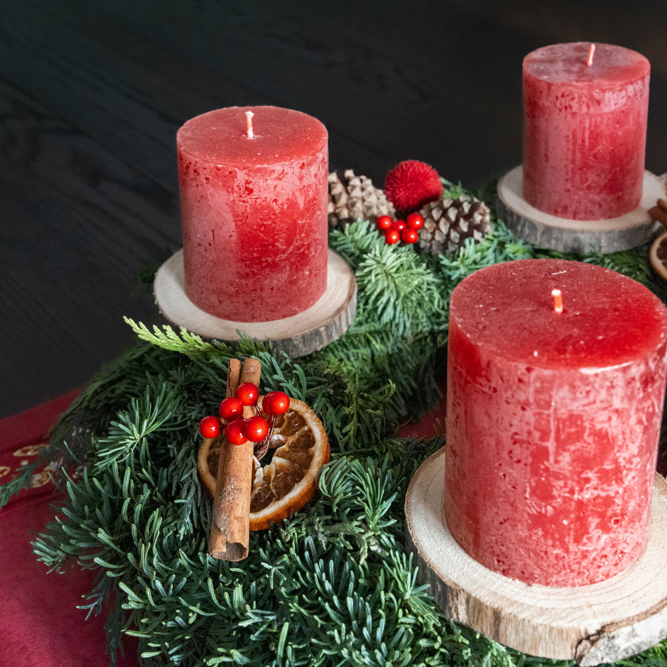 Three red candles on an Advent wreath