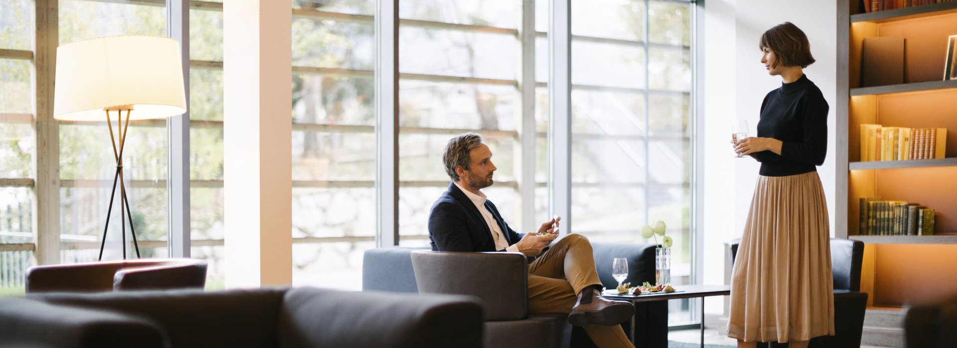 Woman and man talking while having a snack at the buffet