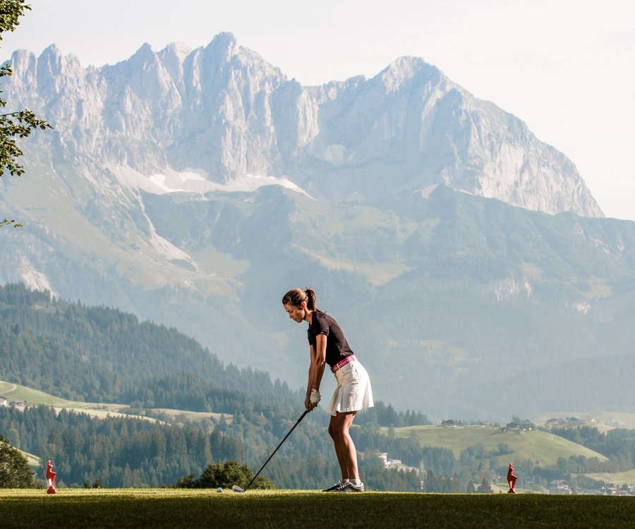 Women playing golf