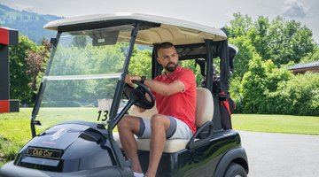 Player in the golf car