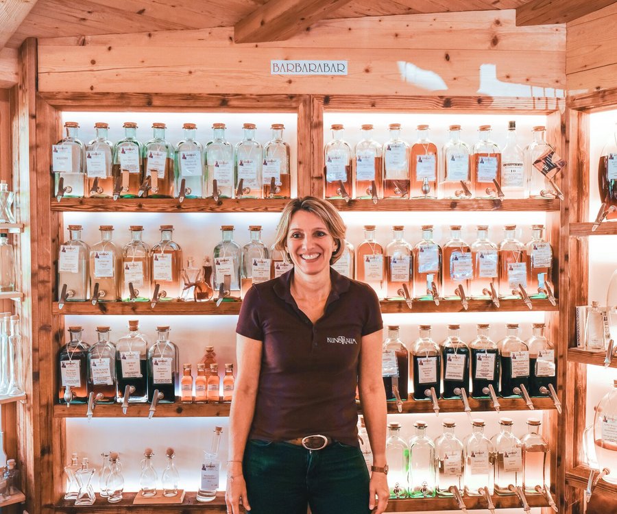 A woman standing in her shop of selfmade products