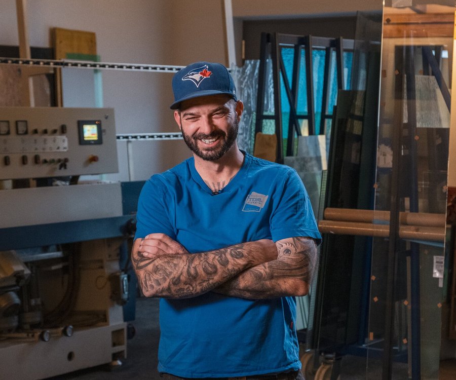 A man stands in his glazier's shop in Kitzbühel