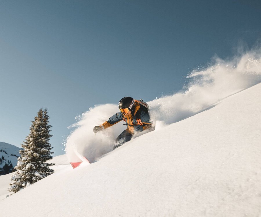 Woman freeriding in deep powder