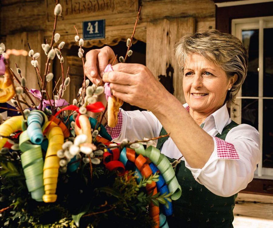 Woman decorates palm bouquets