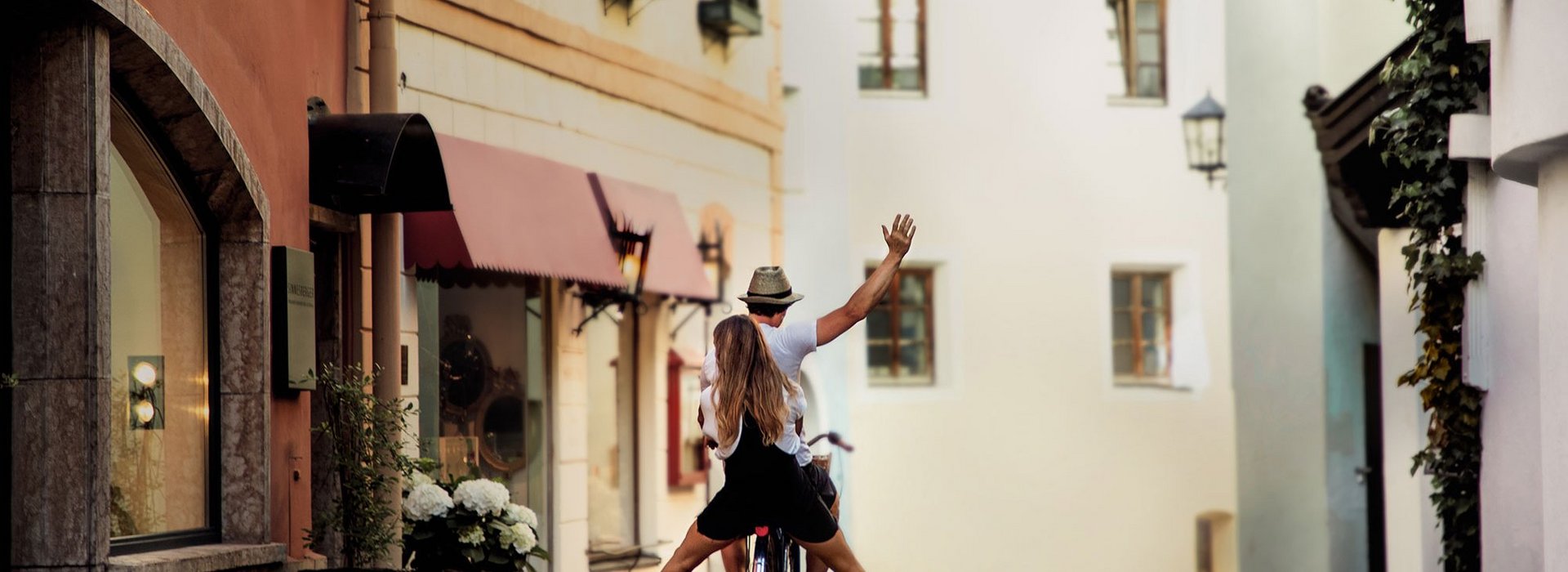 Couple cycling in the city center