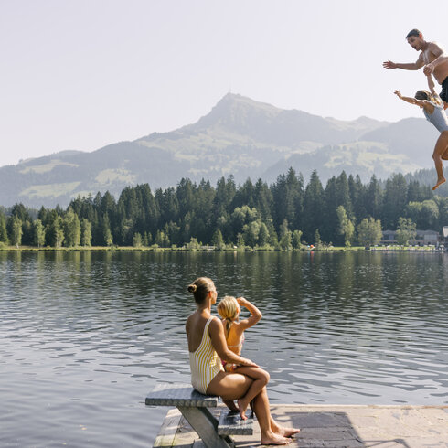 A dive from the three-meter board into Lake Schwarzsee near Kitzbühel