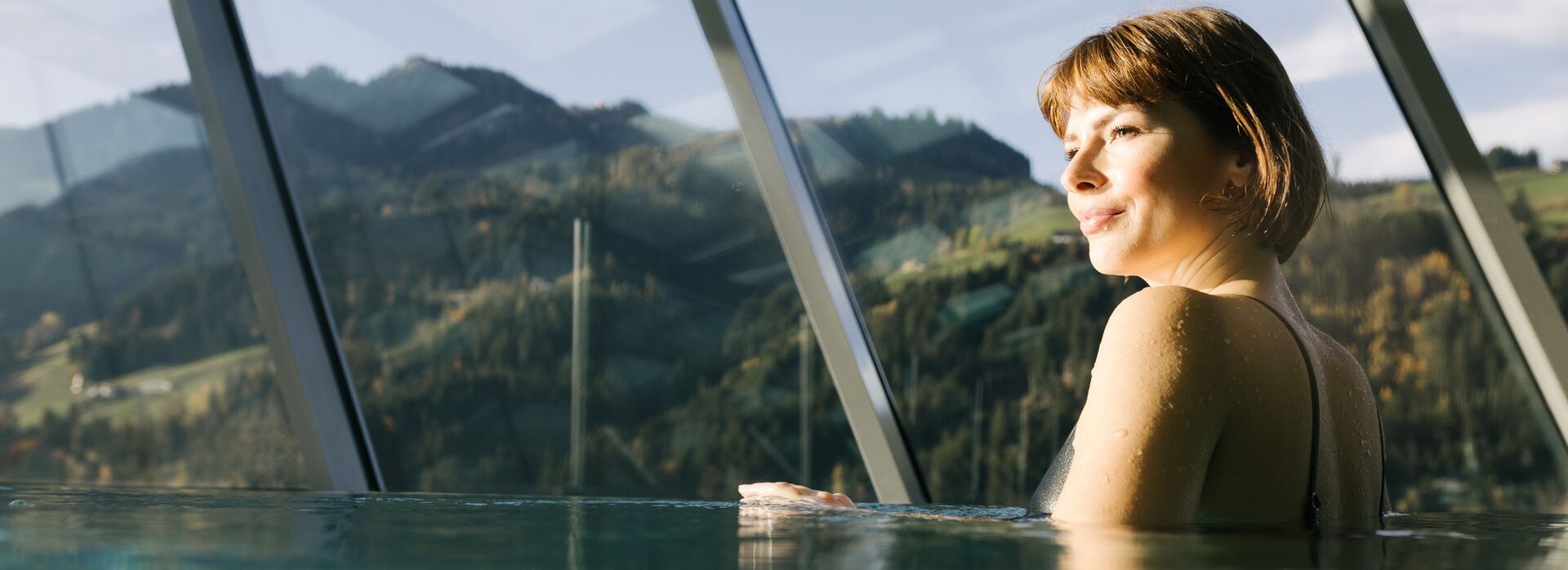 Woman relaxing in the spa area of a Kitzbühel hotel