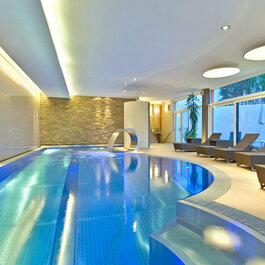 As a guest at the Schweizerhof, enjoy this golf paradise in the heart of the Alps—the indoor pool