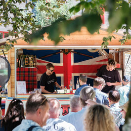 People in front of the drinks kiosk