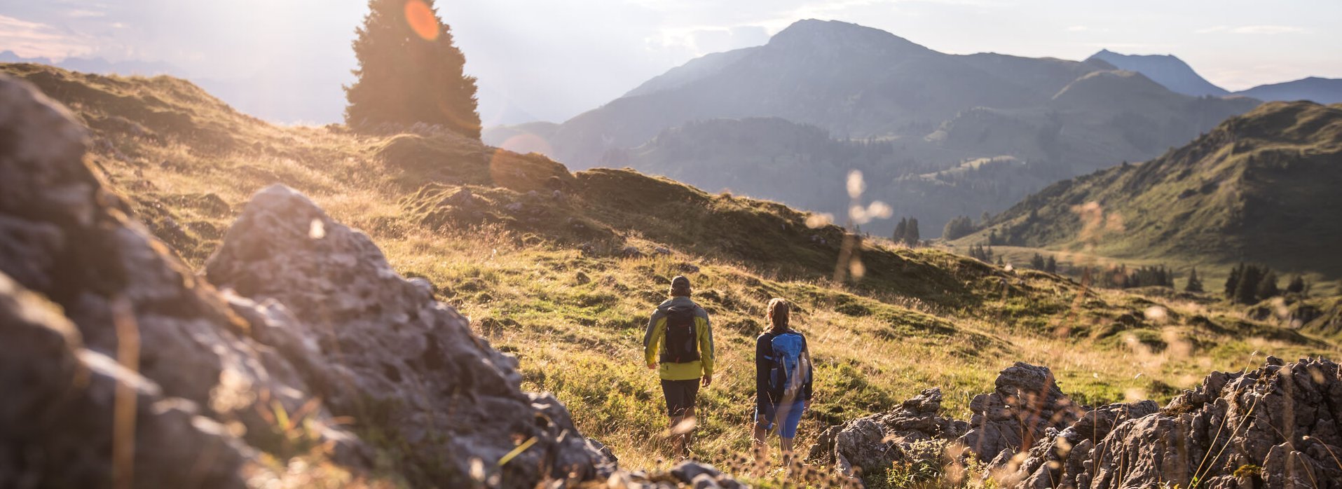 Two people walking in the mountains