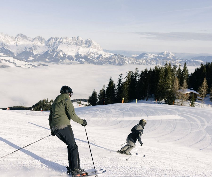 A Couple skiing on the Hahnenkamm slopes