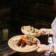 A waitress serves breakfast on the mountain in Kitzbühel