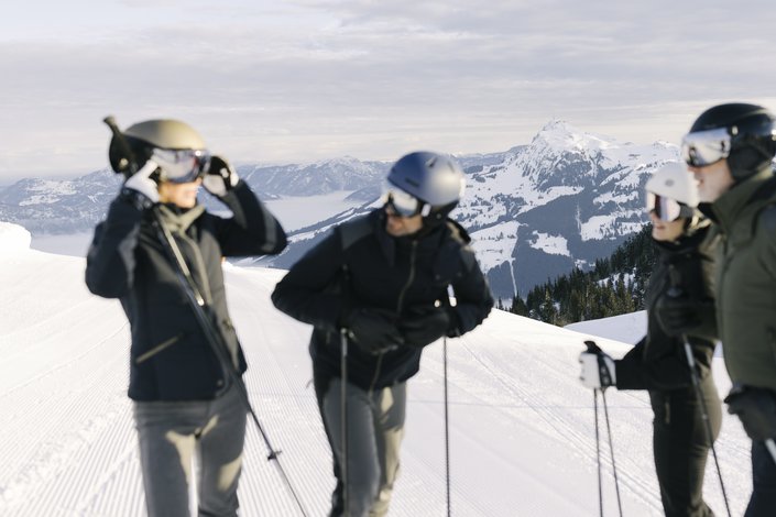 Group chatting during a break while skiing