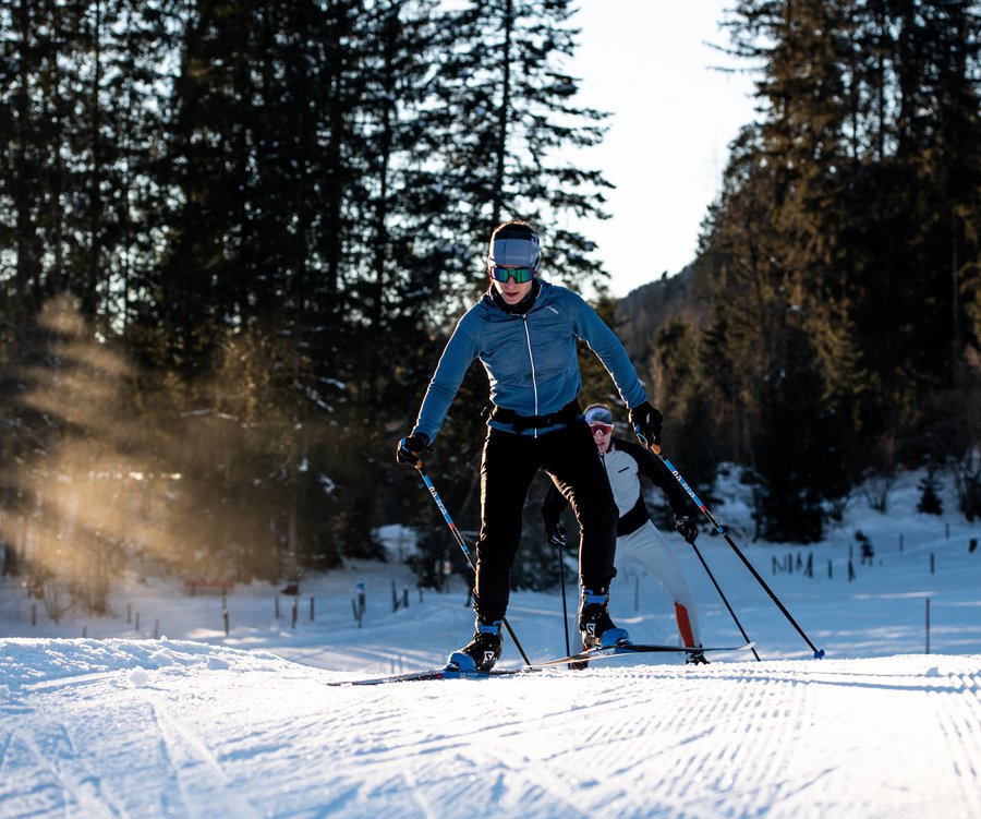 A couple cross country skiing