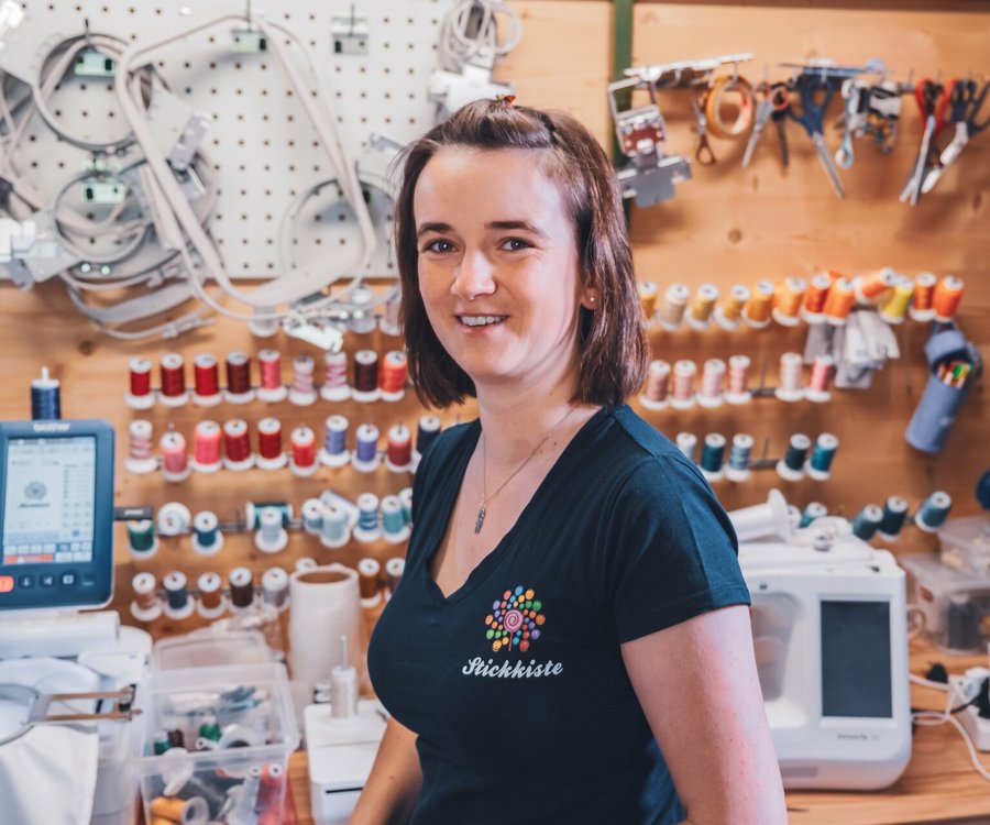 A woman standing in her stitching room