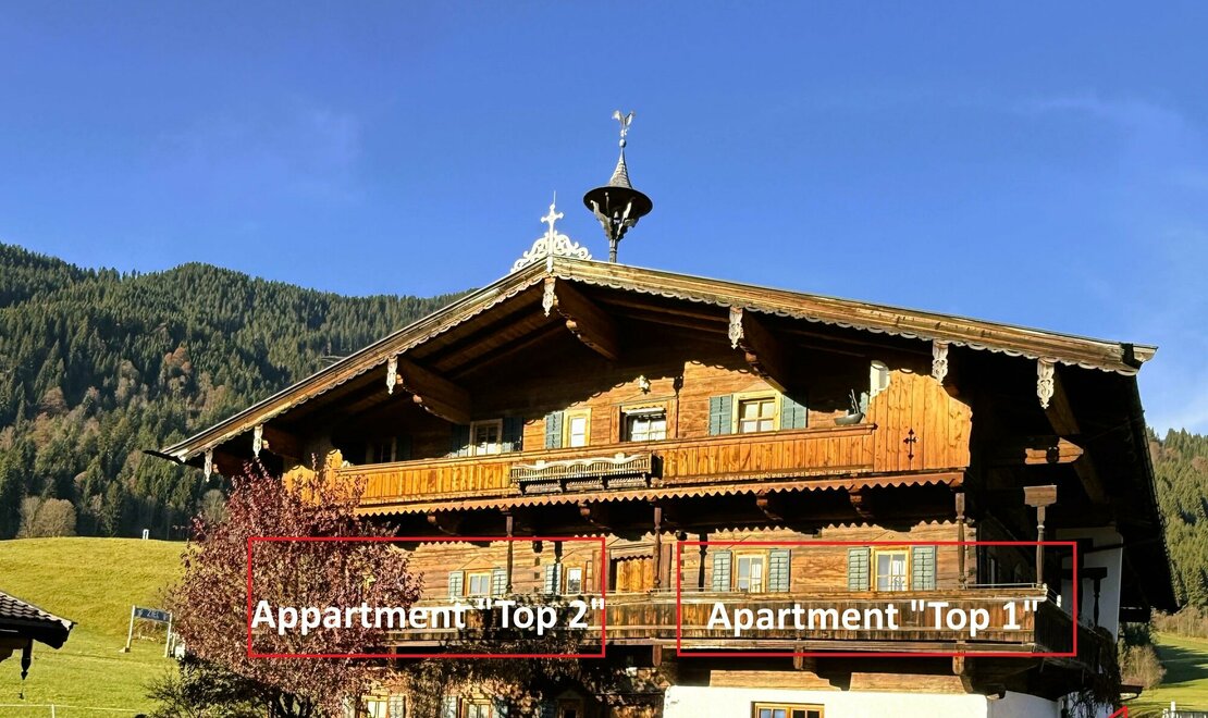 Neuhaus mit Apartmentbeschreibung