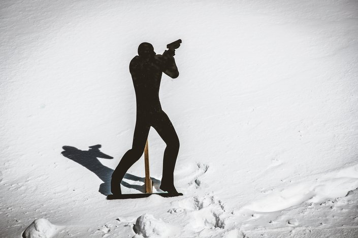 Man in snow with a gun James Bold Style 