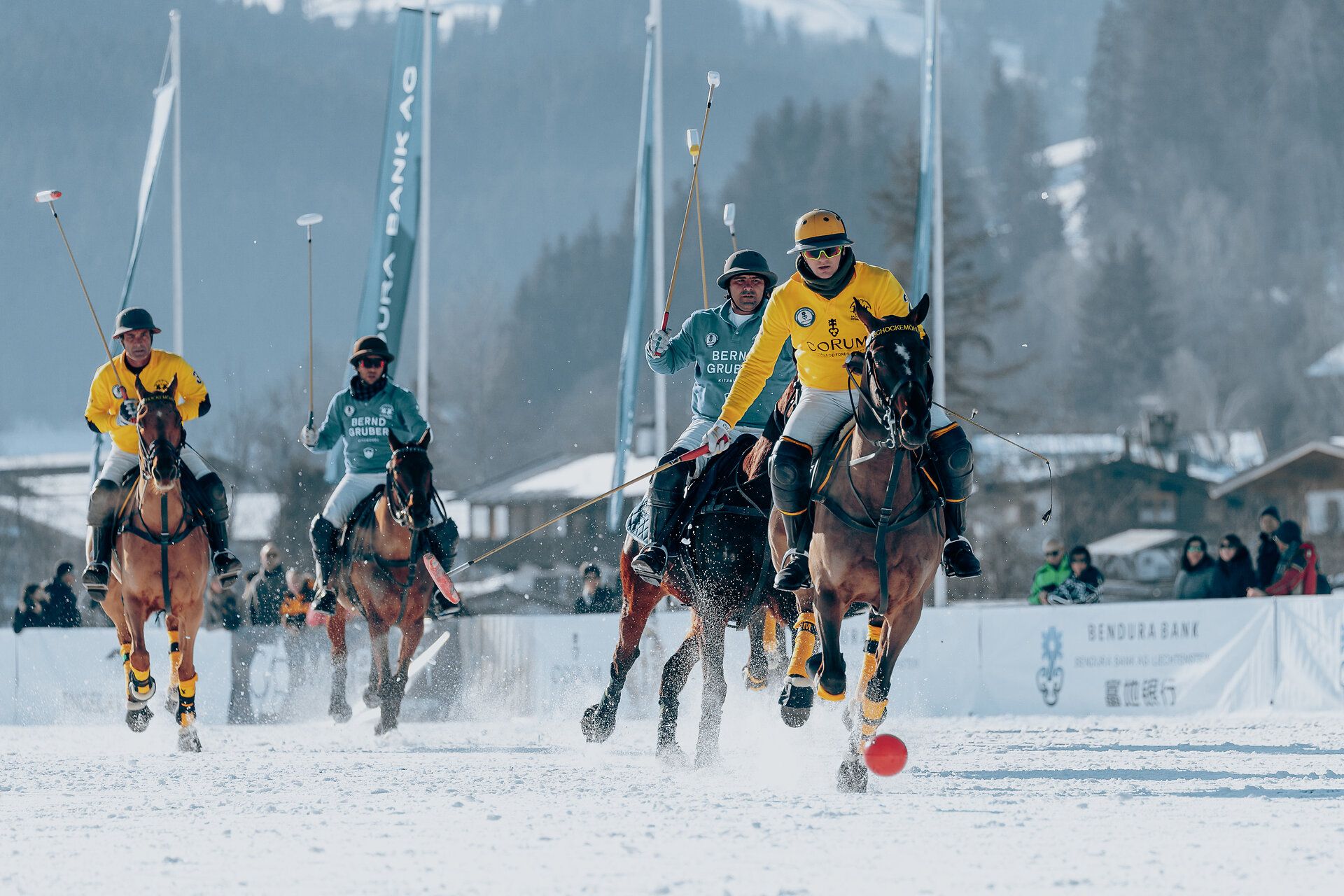 Snow polo players during a match at the Snow Polo tournament in Kitzbühel